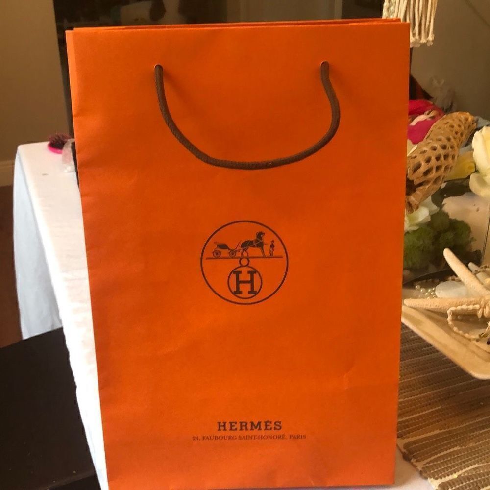 Hermes Paris Orange large rectangular shopping bag.